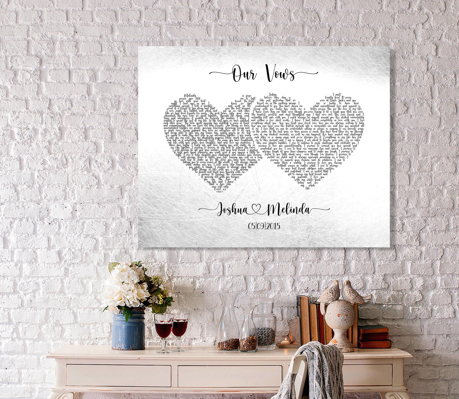 A custom metal wedding vow plaque hangs above a desk. The wedding vows are inscribed on aluminum alloyed tin and fashioned into heart shaped paragraphs - one heart for each set of vows. The bride and grooms names and union date sit below the heart shaped wedding vow paragraphs.
This is a distressed metal art piece, representative of the imperfectly perfect union of love.

Photo courtesy of Honeycomb Proverbs