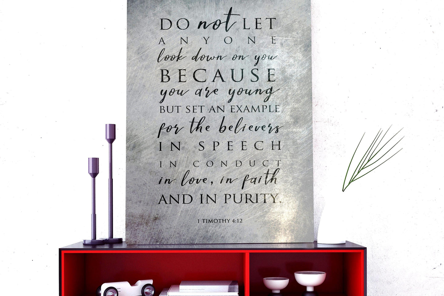 Metal Distressed Christian Wall Art with a black inspirational quote: "DO not LET ANYONE look down on you BECAUSE you are young BUT SET AN EXAMPLE for the believers IN SPEECH IN CONDUCT in love, in faith AND IN PURITY." The quote is attributed to 1 Timothy 4:12.

Photo courtesy of Honeycomb Proverbs