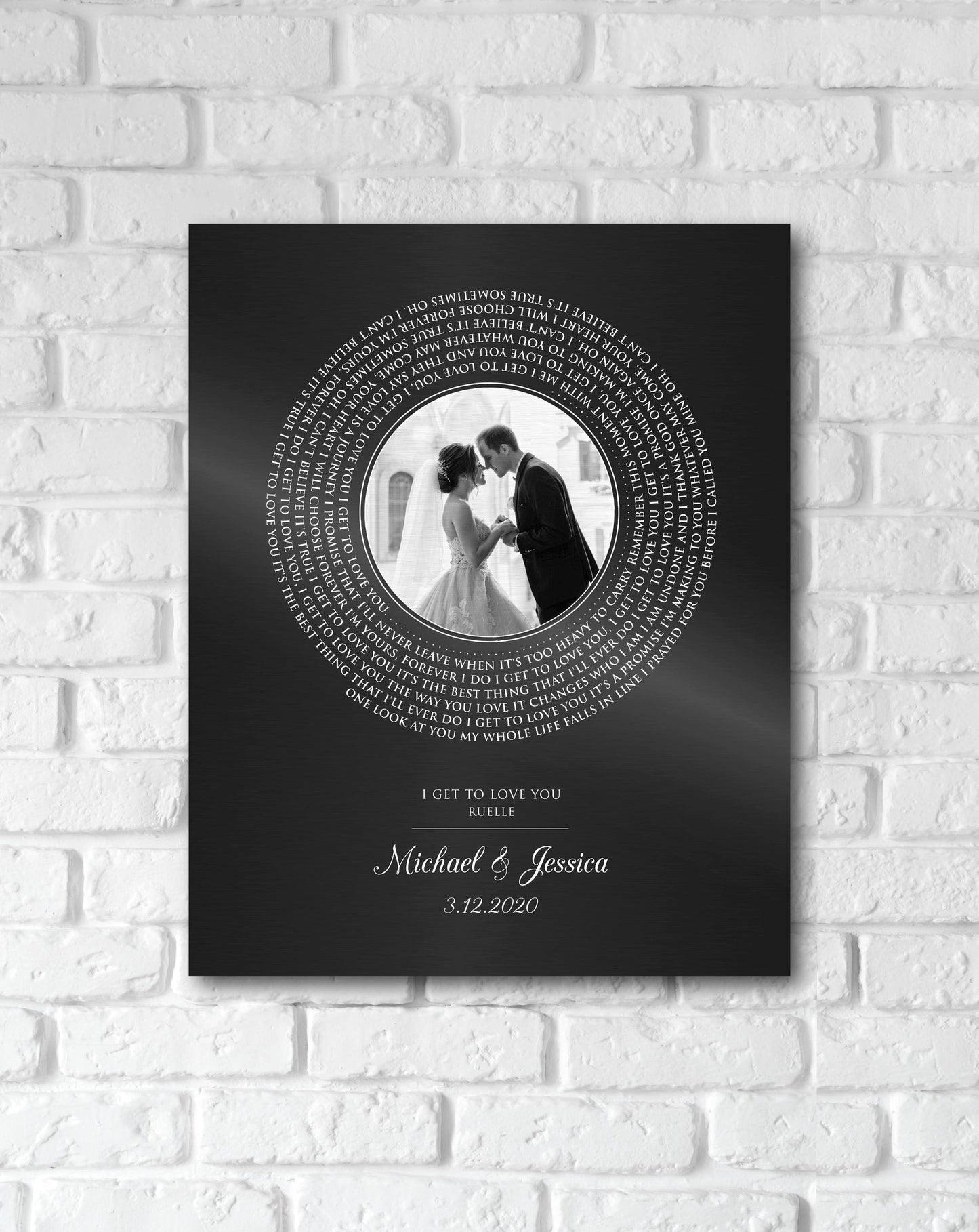 Iron anniversary photo-record plaque features a round wedding portrait as the "label" with song lyrics wrapped around it. The names Michael and Jessica sit beneath the record portrait, with the date 3.12.2020 on the bottom.