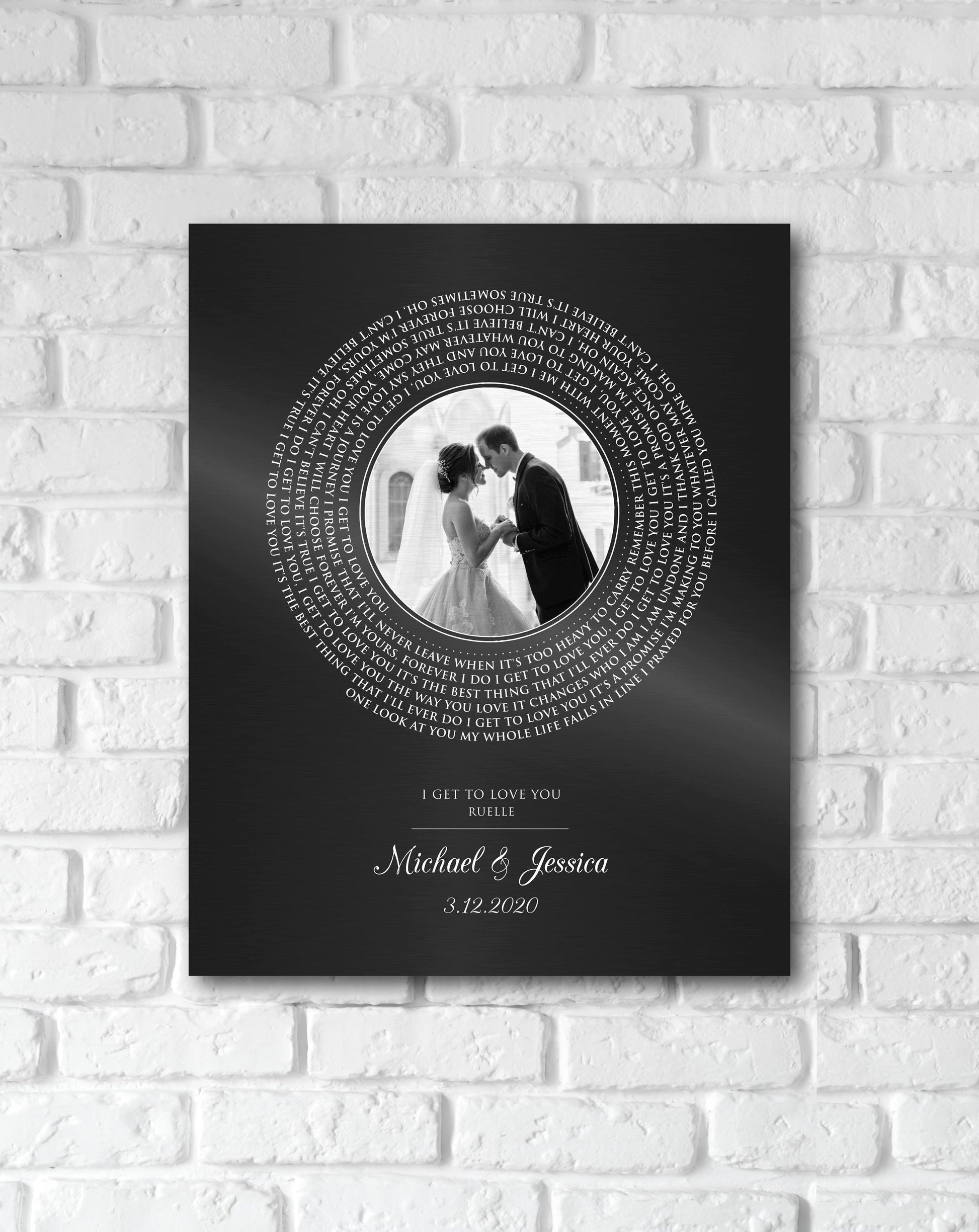 Iron anniversary photo-record plaque features a round wedding portrait as the "label" with song lyrics wrapped around it. The names Michael and Jessica sit beneath the record portrait, with the date 3.12.2020 on the bottom.