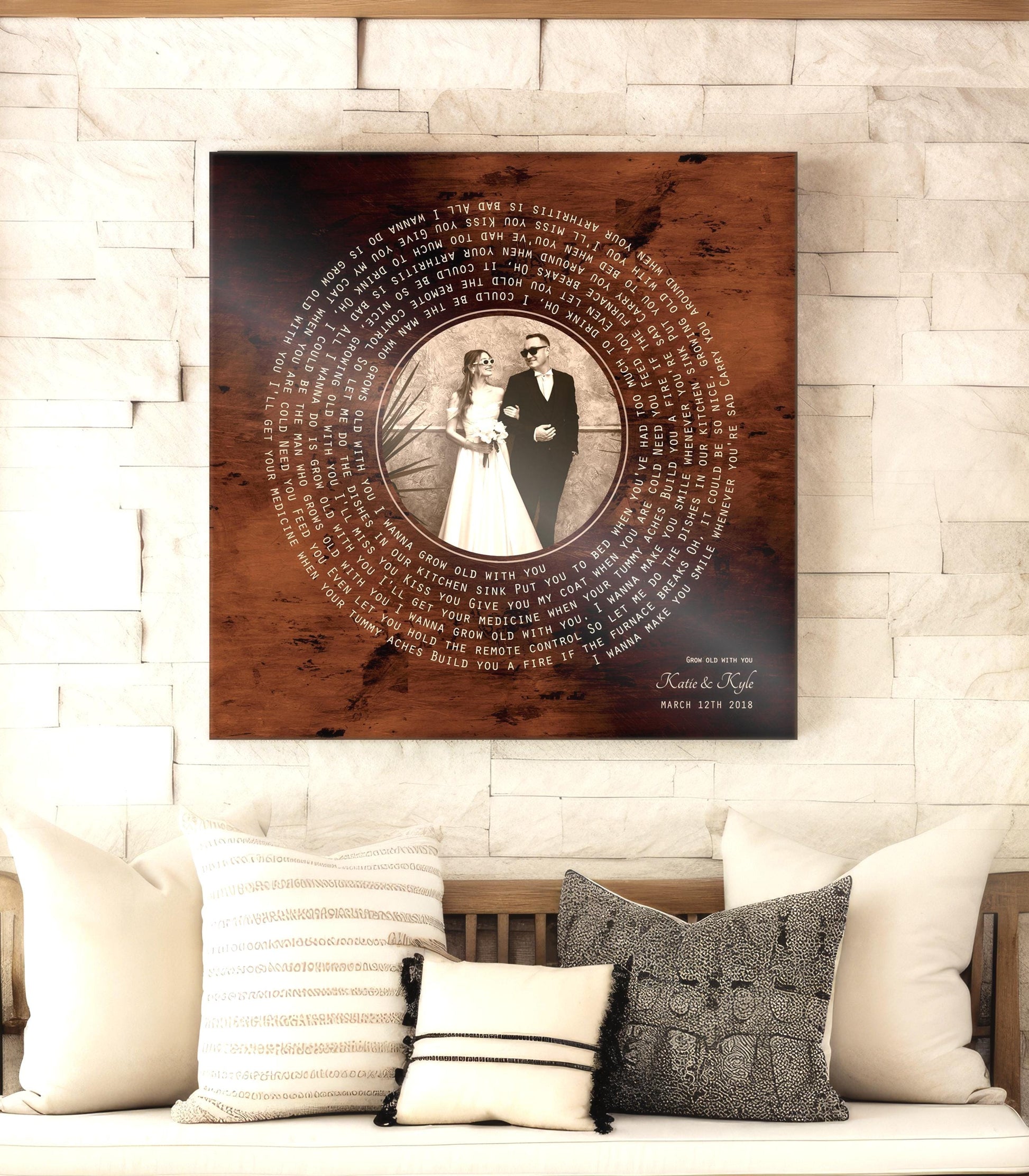 Custom bronze anniversary photo song record on burnished bronzed metal, with the photo in the center and song lyrics wrapped around it to make a vinyl record design. 
Couples names and wedding dates sit beneath the record motif, with song credit and wedding date.