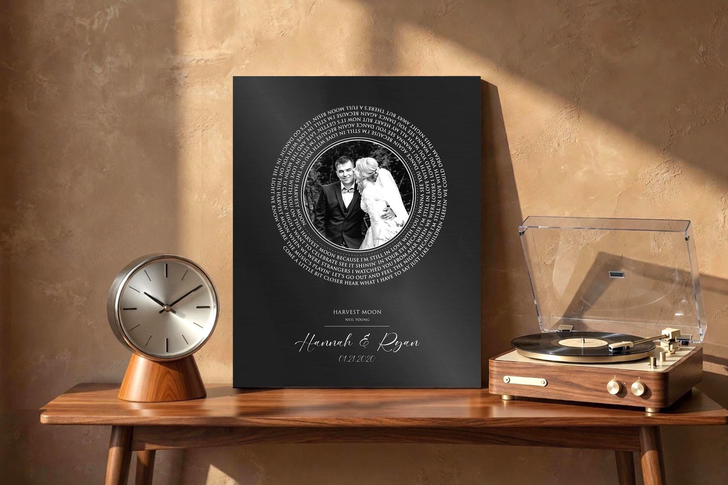 Metal Photo Record with iron finish features a custom photograph center with spiral song lyrics wrapped around the photo, and names and a date beneath. This is a custom iron 6 year anniversary plaque.