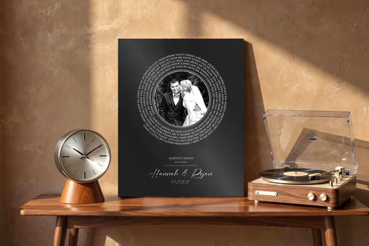Metal Photo Record with iron finish features a custom photograph center with spiral song lyrics wrapped around the photo, and names and a date beneath. This is a custom iron 6 year anniversary plaque.
