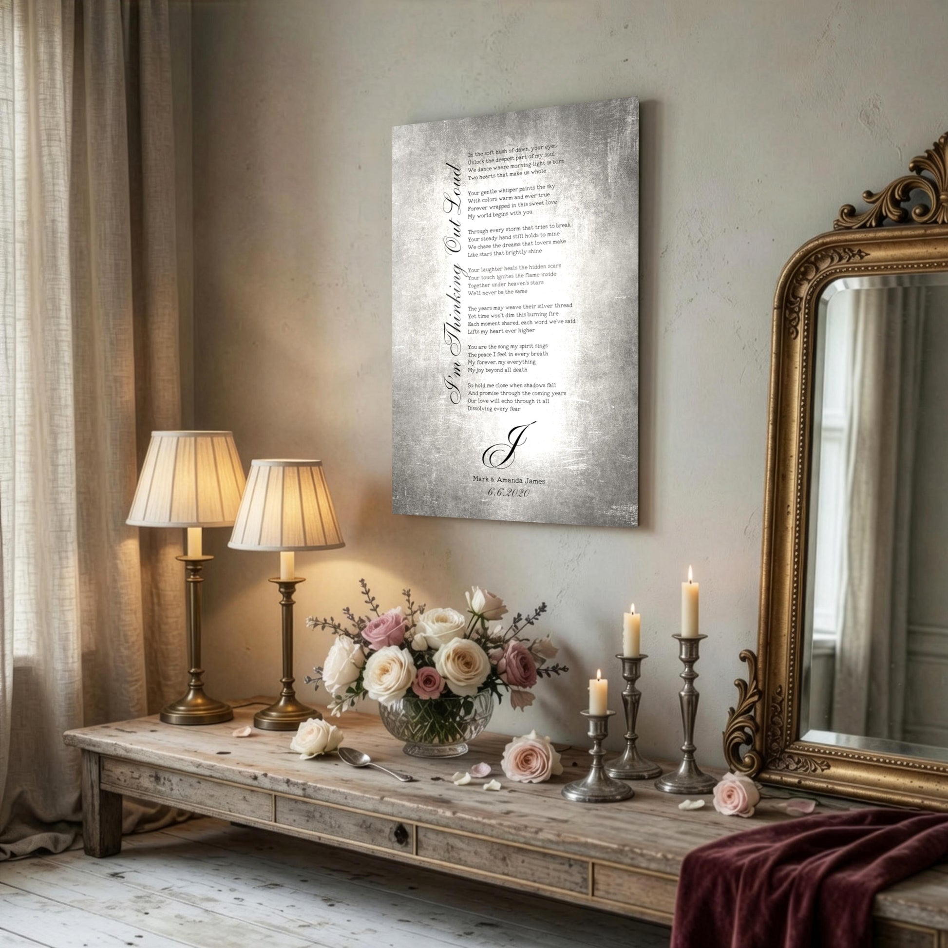 A custom metal sign with a tarnished metal finish is in an elegant lifestyle setting, hanging on a wall above 2 lamps.
