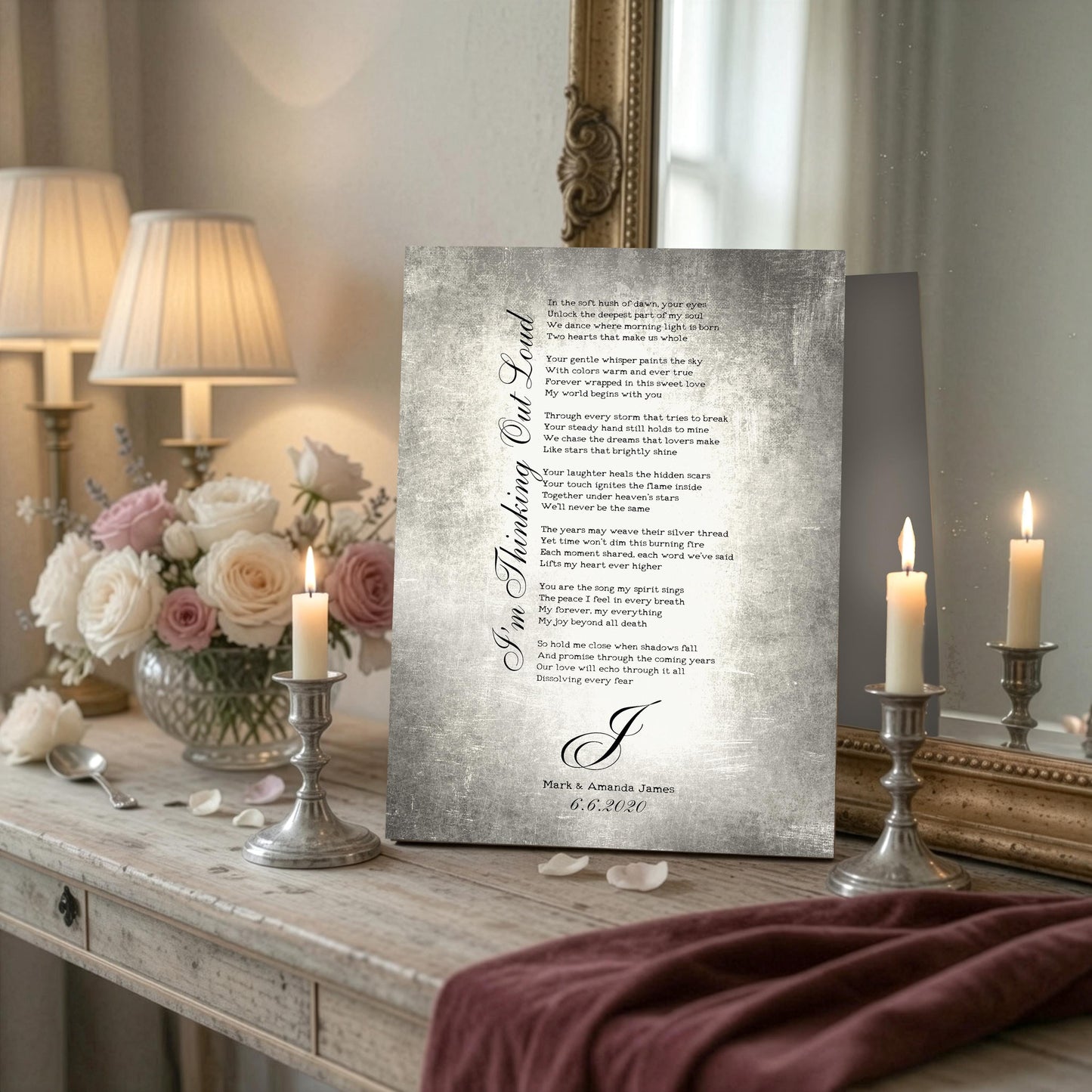 Custom metal plaque with personalized song lyrics, a monogram letter, and the names of a married couple celebrating a ten year anniversary. The plaque is displayed on a table next to a candle-flame.